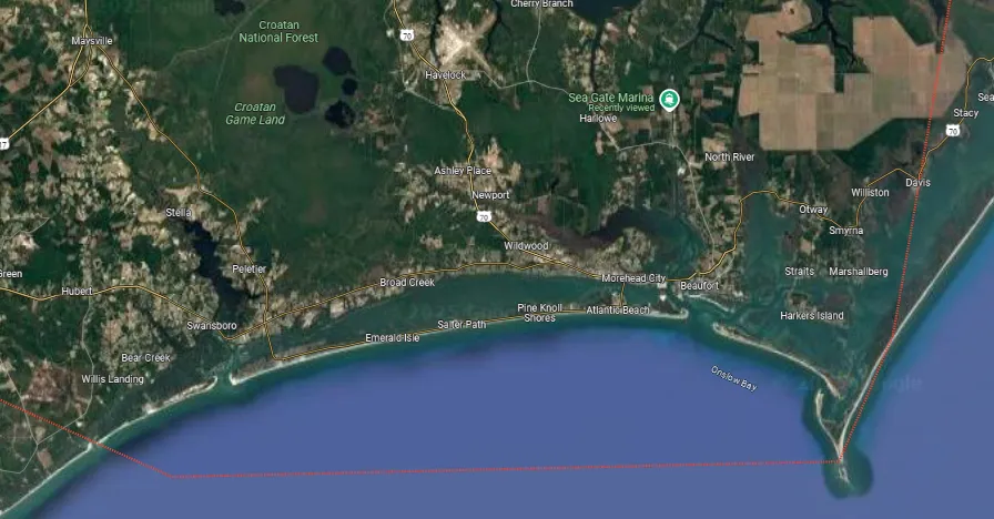Satellite map showing coastal towns, highways, and green forest areas near the Croatan National Forest, North Carolina.